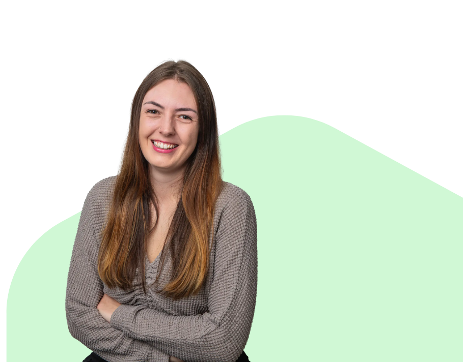 Photo of woman smiling with crossed arms